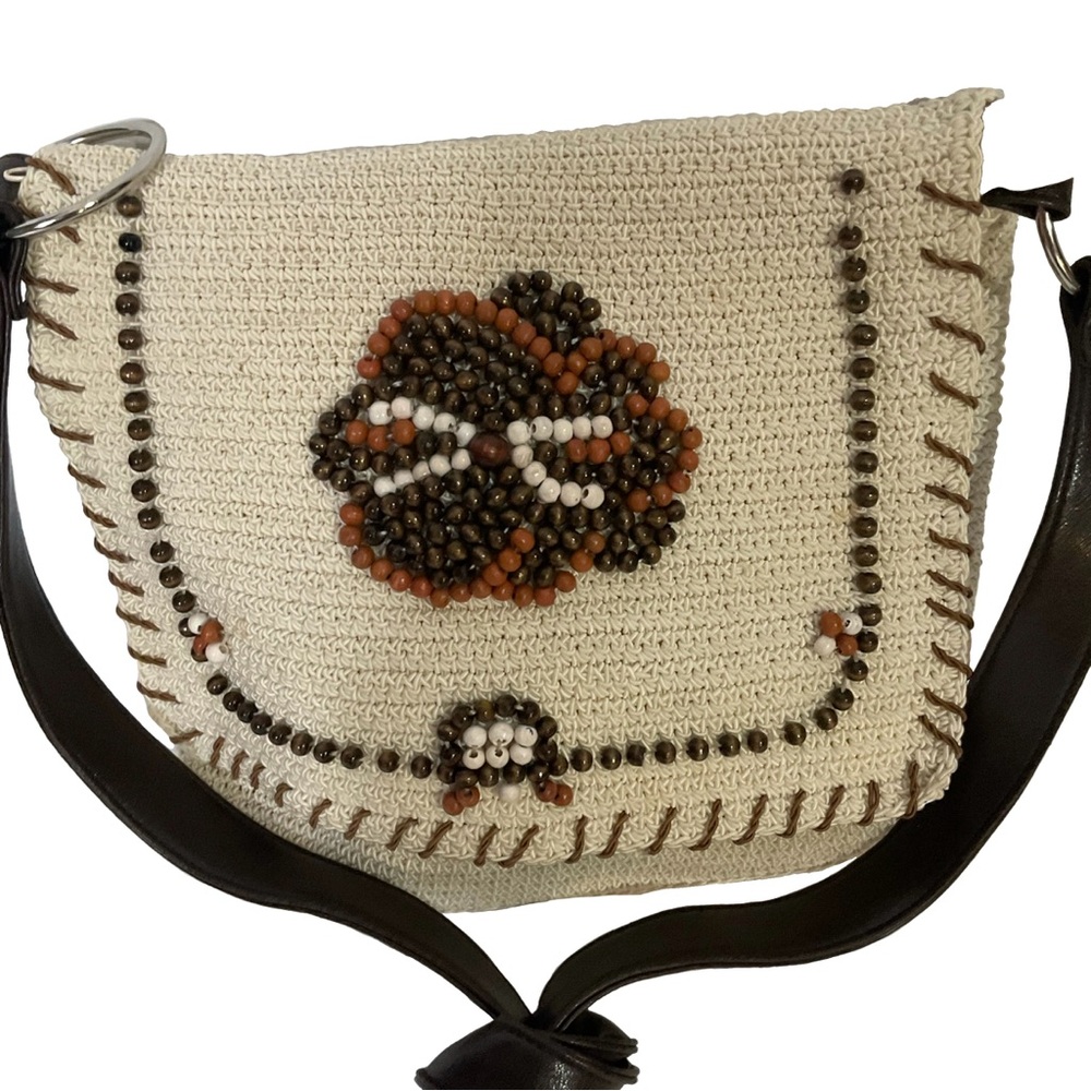 Vintage-inspired cream crochet beaded floral bag with brown leather straps; Nice